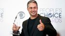 Taylor Kinney poses with his award during the People's Choice Awards 2016 in Los Angeles