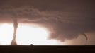 Multiple Tornadoes Illuminated by Lightning A bright burst of lightning illuminates two after-dark tornadoes near La Crosse, Kansas on May 25, 2012