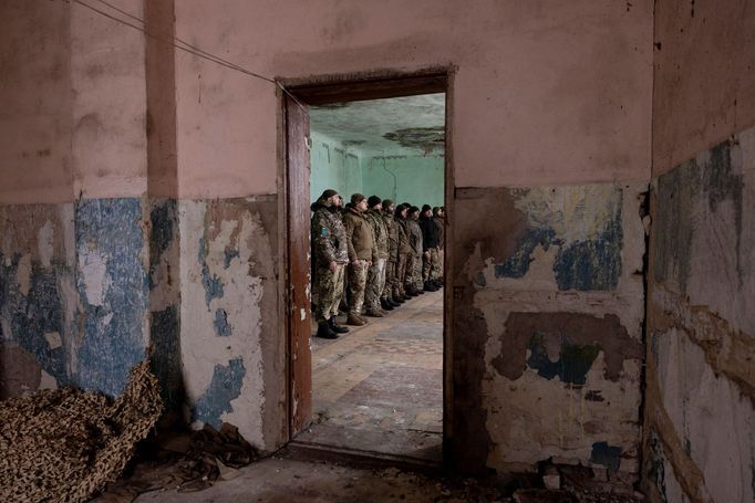 Soldiers of the 93rd separate mechanized brigade attend a Christmas Day service near the front line in the Donetsk region as Ukrainians celebrate their first Christmas ac