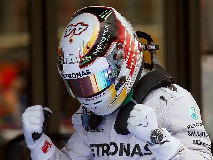 Mercedes Formula One driver Lewis Hamilton of Britain celebrates after taking the pole position at the qualifying session of the Spanish F1 Grand Prix at the Barcelona-Ca