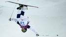 Heather McPhie of the U.S. performs a jump during the women's freestyle skiing moguls final competition at the 2014 Sochi Winter Olympic Games in Rosa Khutor, February 8,