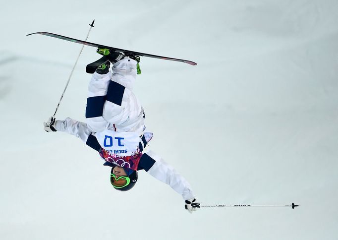 Heather McPhie of the U.S. performs a jump during the women's freestyle skiing moguls final competition at the 2014 Sochi Winter Olympic Games in Rosa Khutor, February 8,