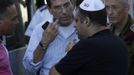 Israeli citizen Izhak Shriki (2nd R), who is searching for his wife, is comforted outside a hospital in the city of Burgas, about 400km (248miles) east of Sofia July 19, 2012. A suicide bomber committed the attack that killed eight people in a bus transporting Israeli tourists at a Bulgarian airport, the country's interior minister said on Thursday, and Israel accused Iranian-backed Hezbollah militants of responsibility. REUTERS/Stoyan Nenov (BULGARIA - Tags: CRIME LAW TRANSPORT)