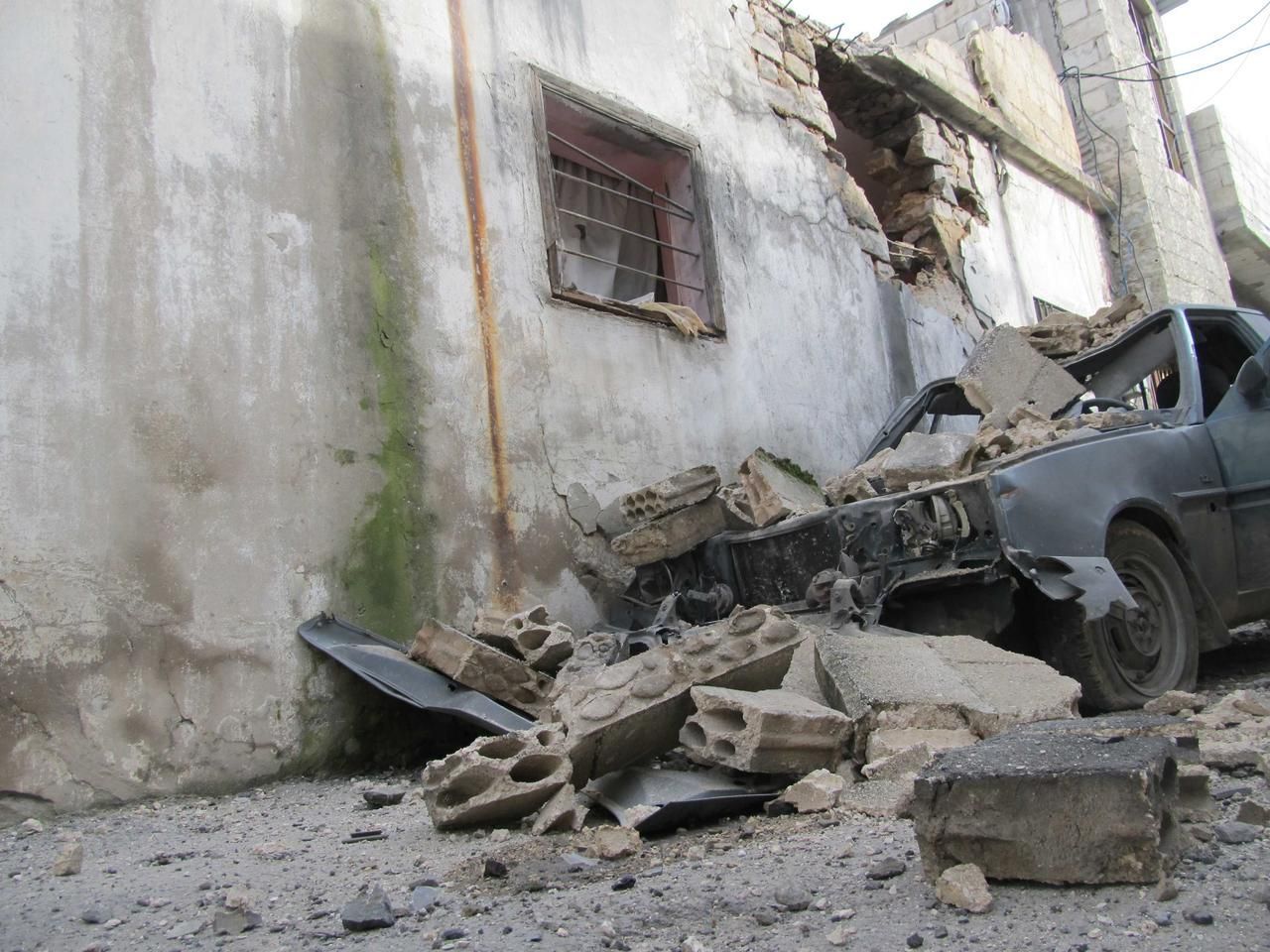 Zničená obytná čtvť v Homsu