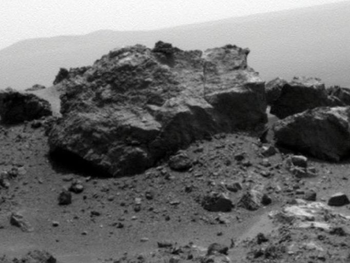 'Ridout' Rock on Rim of Odyssey Crater NASA's Mars Exploration Rover Opportunity looked across a small crater on the rim of a much larger crater to capture this raw image from its panoramic camera during the rover's 2,685th Martian day, or sol, of work on Mars (Aug. 13, 2011). Opportunity had arrived at the western rim of 13-mile-diameter (21-kilometer-diameter) Endeavour crater four days earlier. A portion of the northeastern rim of Endeavour forms the distant horizon in this view. A crater about 66 feet (20 meters) in diameter is on the Endeavour rim near Opportunity's arrival point. From a position south of Odyssey, this view is dominated by a rock informally named "Ridout" on the northeastern rim of Odyssey. The rock is roughly the same size as the rover, which is 4.9 feet (1.5 meters) long. Image Credit: NASA/JPL-Caltech/Cornell/ASU