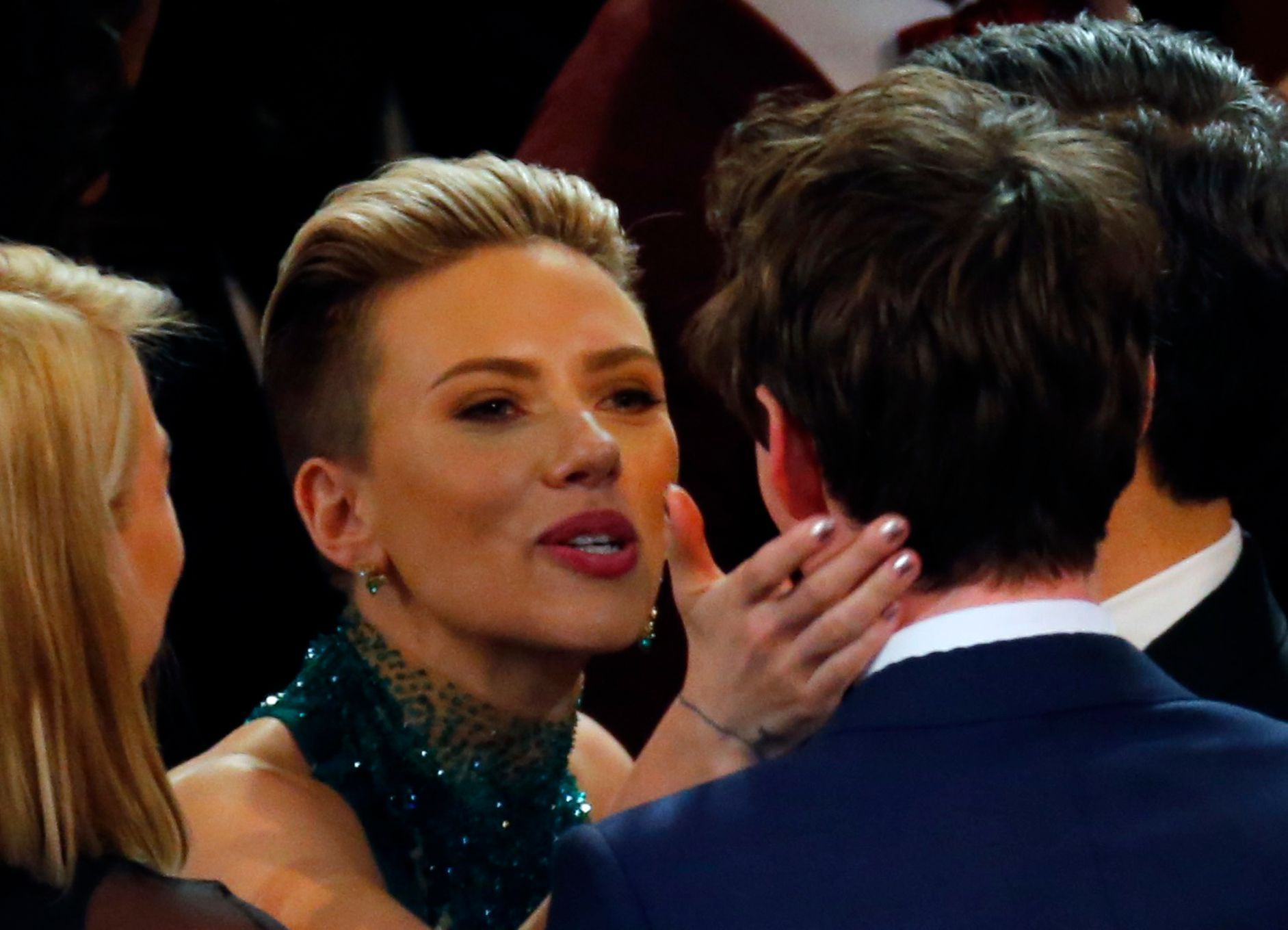 Scarlett Johansson embraces best actor winner Eddie Redmayne after the show at the 87th Academy Awards in Hollywood, California