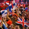 Fans wave flags during the first semifinal of the upcoming 60th annual Eurovision Song Contest In Vienna