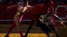 Colombian matador Luis Bolivar performs a pass to a bull during a bullfight in Seville