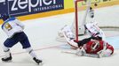 Kazakhstan's Nigel Dawes scores on Switzerland's Reto Berra