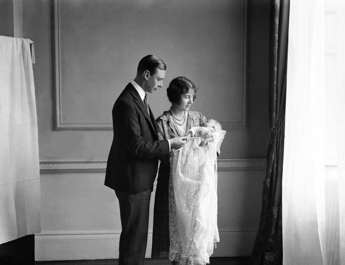 The Queen Mother (then the Duchess of York) with her husband, King George VI (then the Duke of York), and their daughter Queen Elizabeth II at her christening in May 1926