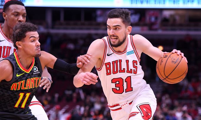 Oct 17, 2019; Chicago, IL, USA; Chicago Bulls guard Tomáš Satoranský (31) dribbles the ball against Atlanta Hawks guard Trae Young (11) during the first half at the Unite