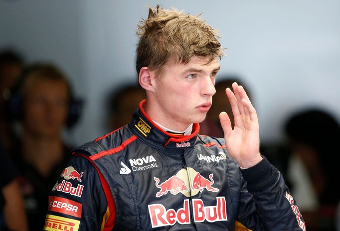 Toro Rosso Formula One driver Max Verstappen of the Netherlands returns to the garage after his car stalled on the track during the first practice session of the Japanese