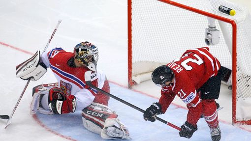Goaltender Jakub Kovar of the Czech Republic reacts after a goal as Canada's Matt Read (R) falls during the second period of their men's ice hockey World Championship gro
