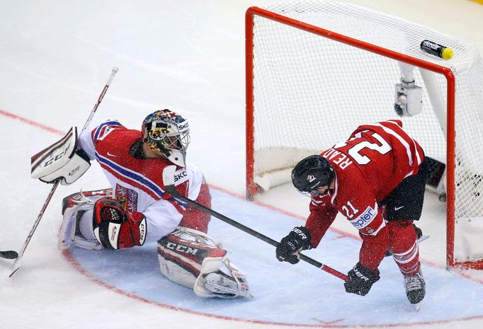 Goaltender Jakub Kovar of the Czech Republic reacts after a goal as Canada's Matt Read (R) falls during the second period of their men's ice hockey World Championship gro