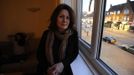 Katarina Germanou poses for a photograph at the family's flat in Potters Bar, on the outskirts of London