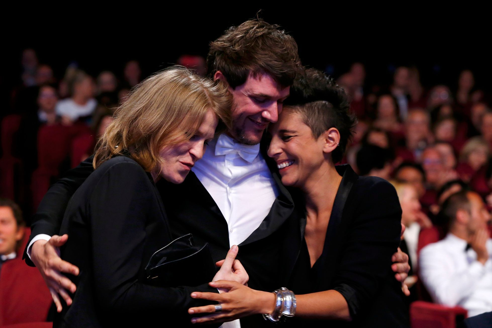 Co-directors Claire Burger, Marie Amachoukeli and Samuel Theis, Camera d'Or award winners for their film &quot;Party Girl&quot;, react after being awarded during the closing ceremony of the 67th Canne