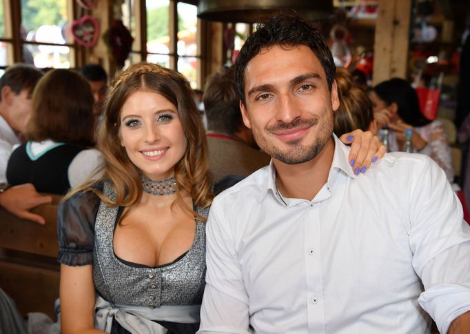 FC Bayern Munich's Hummels and his wife Cathy pose during their visit at the Oktoberfest in Munich