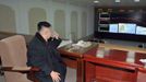 North Korean leader Kim Jong-Un smokes a cigarette at the General Satellite Control and Command Center after the launch of the Unha-3 (Milky Way 3) rocket carrying the second version of Kwangmyongsong-3 satellite at West Sea Satellite Launch Site in Cholsan county, North Pyongan province in this December 12, 2012 file photo, released by the North Korea's KCNA news agency in Pyongyang December 13, 2012. The latest U.N. sanctions on the regime of North Korean leader Kim tighten financial restrictions, including the illicit transfer of bulk cash, and crack down on its attempts to ship and receive banned cargo. The aim of the March 7, 2013 measures is to curtail the North's nuclear and ballistic missile programmes