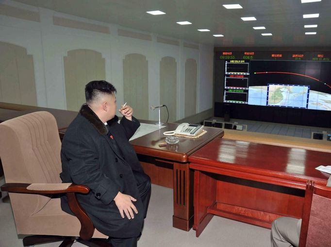 North Korean leader Kim Jong-Un smokes a cigarette at the General Satellite Control and Command Center after the launch of the Unha-3 (Milky Way 3) rocket carrying the second version of Kwangmyongsong-3 satellite at West Sea Satellite Launch Site in Cholsan county, North Pyongan province in this December 12, 2012 file photo, released by the North Korea's KCNA news agency in Pyongyang December 13, 2012. The latest U.N. sanctions on the regime of North Korean leader Kim tighten financial restrictions, including the illicit transfer of bulk cash, and crack down on its attempts to ship and receive banned cargo. The aim of the March 7, 2013 measures is to curtail the North's nuclear and ballistic missile programmes