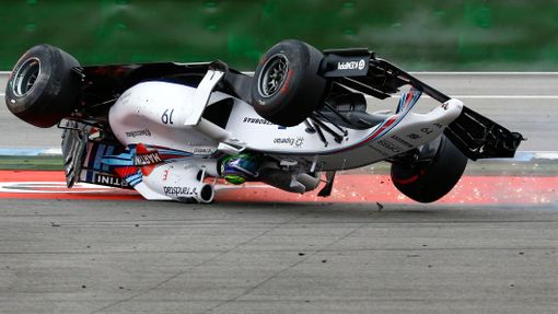 Williams Formula One driver Felipe Massa of Brazil crashes with his car in the first corner after the start of the German F1 Grand Prix at the Hockenheim racing circuit,