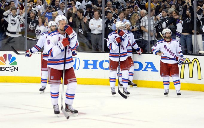 Jun 13, 2014; Los Angeles, CA, USA; New York Rangers players react after losing 3-2 in two overtimes to the Los Angeles Kings in game five of the 2014 Stanley Cup Final a