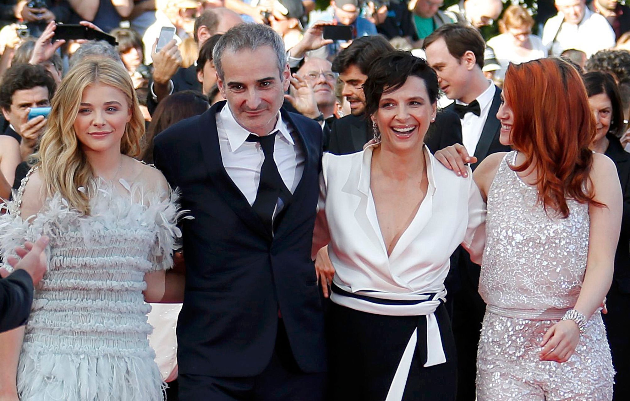 Director Olivier Assayas, cast members Kristen Stewart, Juliette Binoche and Chloe Grace Moretz pose on the red carpet as they arrive for the screening of the film &quot;Sils Maria&quot;  in competiti