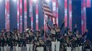 REFILE - CORRECTING TEAM U.S. Team flag-bearer Jon Lujan (C), leads his country's contingent during the opening ceremony of the 2014 Paralympic Winter Games in Sochi, Mar