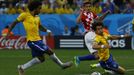 Brazil's Marcelo scores an own goal as Croatia's Nikica Jelavic and Brazil's David Luiz look on during the 2014 World Cup opening match between Brazil and Croatia at the