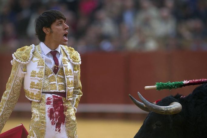 Spanish matador Antonio Nazare reacts in front to a bull during a bullfight in Seville