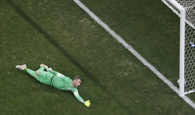 Croatia's goalkeeper Stipe Pletikosa fails to save the goal scored by Brazil's Neymar (unseen) during the 2014 World Cup opening match at the Corinthians arena in Sao Pau