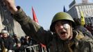 An anti-government protester cheers during a rally in Kiev February 21, 2014.