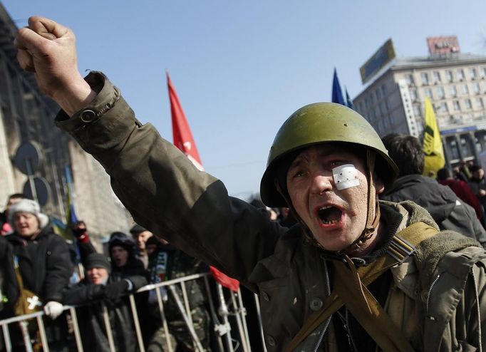 An anti-government protester cheers during a rally in Kiev February 21, 2014.