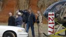 Law enforcement officials talk at a roadblock near the scene of a shooting and hostage taking near Midland City, Alabama February 1, 2013. Residents in a rural Alabama town prayed on Friday and called for the release of a 5-year-old boy being held captive for a fourth day by a man accused of shooting a school bus driver and then taking the child hostage. REUTERS/Phil Sears (UNITED STATES - Tags: CRIME LAW) Published: Úno. 1, 2013, 9:32 odp.