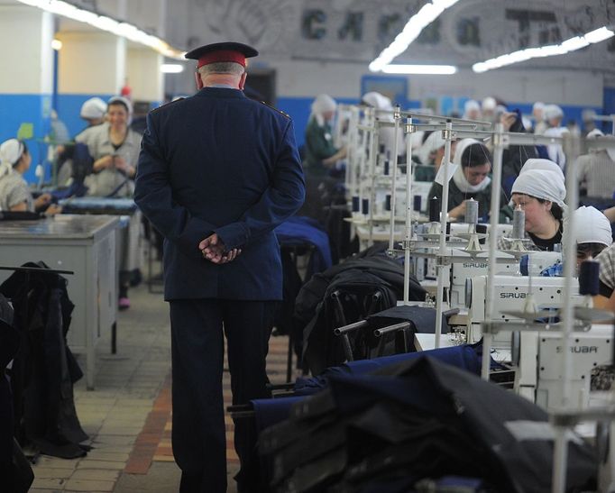 Ivanovo Region prison colony for convicted women IVANOVO REGION, RUSSIA. APRIL 25, 2012. A prison guard and convicted women at work in the sewing room at Women's Prison Colony No3 of the Ivanovo Region branch of the Russian Federal Service of Execution of Sentences (UFSIN) pose for photographs during a fashion show.