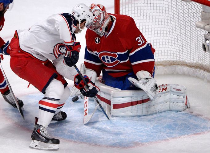 Ar´tom Anisimov a Carey Price v NHL 2014-15