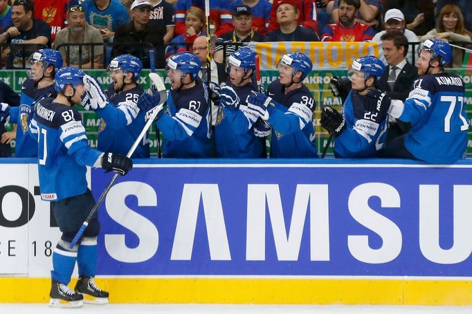 Finland's Iiro Pakarinen (L) celebrates his goal against Russia during the first period of their men's ice hockey World Championship final game at Minsk Arena in Minsk Ma