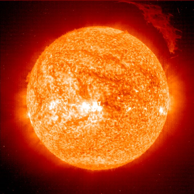 The Sun ejected a spectacular "eruptive prominence," a mass of relatively cool plasma, into space on Friday, March 12. The gas was relatively cool - only 60,000-80,000 Kelvin (110,000 - 145,000 degrees F) compared with the fiery 1.5 million degree K plasma (2.7 million F) surrounding it in the Sun's outer atmosphere, or corona. At the time of this snapshot, the eruptive prominence was over 700,000 km (420,000 miles across), over 50 times the Earth's diameter. That's like measuring the length of 50 Earth's standing side-by-side! Even more, the plasma was moving at a rate of over 75,000 km per hour (50,000 mph). Eruptive prominences of this size are associated with coronal mass ejections (CME's), and the CME-prominence combination can deliver a powerful one-two punch to the earth's magnetosphere when directed toward Earth. In this case, the prominence and associated coronal mass ejection were directed away from the Earth and out into space. SOHO is a mission of international cooperation between the European Space Agency (ESA) and NASA. It was launched on December 2, 1995 from Cape Canaveral aboard an Atlas IIAS launch vehicle.