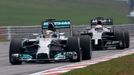 Mercedes Formula One driver Lewis Hamilton of Britain drives ahead of McLaren Formula One driver Jenson Button of Britain during the second practice session of the Malays