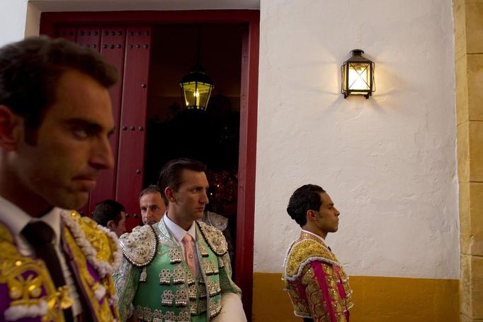 Spanish matador Salvador Cortes, Colombian matador Luis Bolivar and assistant Francisco J. Tornay wait before the start of a bullfight in The Maestranza bullring in Seville