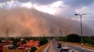 INDIA-WEATHER-DUST STORM (130614) -- BIKANER, June 14, 2013 -- Vehicles move on a road during a dust storm in Bikaner of Rajasthan, India, June 13, 2013.