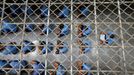 Inmates sit on the floor during an inspection visit in the long-term sentence zone inside Klong Prem high-security prison in Bangkok, Thailand July 12, 2016.