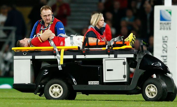 Scott Williams of Wales is stretchered off injured