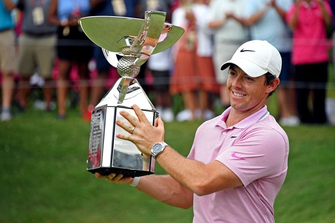 Aug 25, 2019; Atlanta, GA, USA; Rory McIlroy celebrates with the FedEx Cup after winning the Tour Championship golf tournament at East Lake Golf Club. Mandatory Credit: A