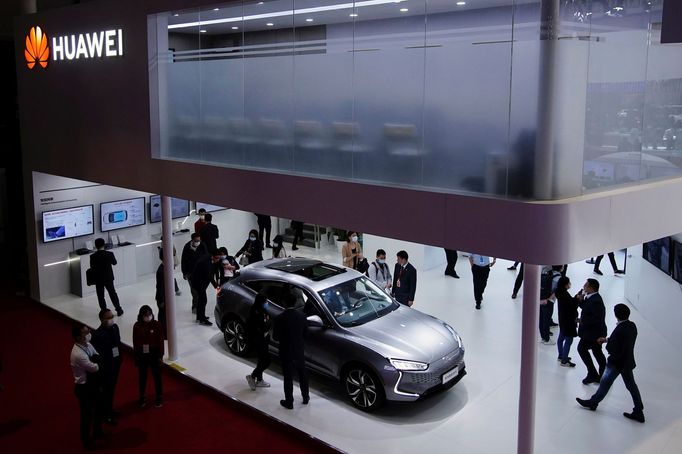 Visitors check a Cyrus Huawei Smart Selection SF5 electric vehicle (EV) displayed at the Huawei booth during a media day for the Auto Shanghai show in Shanghai, China Apr