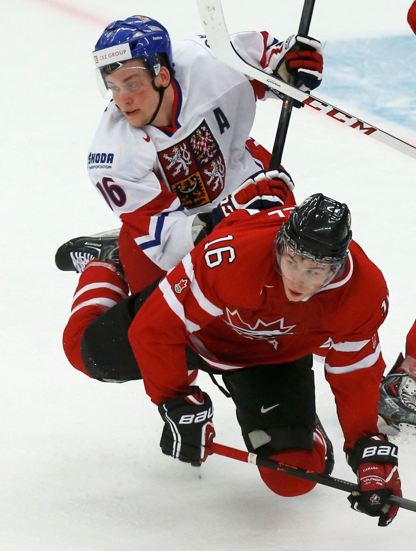 Czech Republic's Faksa checks Canada's Rychel during the second period of their IIHF World Junior Championship ice hockey game in Malmo