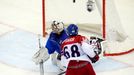 Jaromir Jagr of the Czech Republic (R) scores past Italy's goalie Daniel Belissimo (R) during the third period of their men's ice hockey World Championship Group A game a