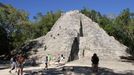 ** CORRECTS DAY TO SATURDAY ** In this Saturday, Dec. 15, 2012 photo, tourists climb the pyramid at the archeological site in Coba, Mexico. Amid a worldwide frenzy of advertisers and new-agers preparing for a Maya apocalypse, one group is approaching Dec. 21 with calm and equanimity ó the people whose ancestors supposedly made the prediction in the first place. (AP Photo/Israel Leal)