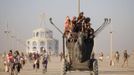 Participants ride an art car during the Burning Man 2012 "Fertility 2.0" arts and music festival in the Black Rock Desert of Nevada August 29, 2012. More than 60,000 people from all over the world have gathered at the sold out festival, which is celebrating its 26th year, to spend a week in the remote desert cut off from much of the outside world to experience art, music and the unique community that develops.