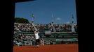 Roberto Bautista Agut of Spain serves during the men's singles match against Florian Mayer of Germany at the French Open tennis tournament at the Roland Garros stadium in