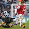 Newcastle United's Tiote challenges Arsenal's Rosicky during their English Premier League soccer match in Newcastle